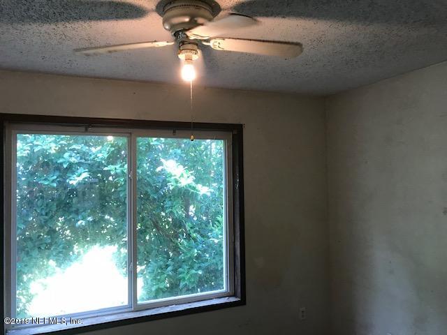 5205 Hancock Road Jacksonville, FL 32254 - Photo 5 of 25 a view of a room with a window and a ceiling fan
