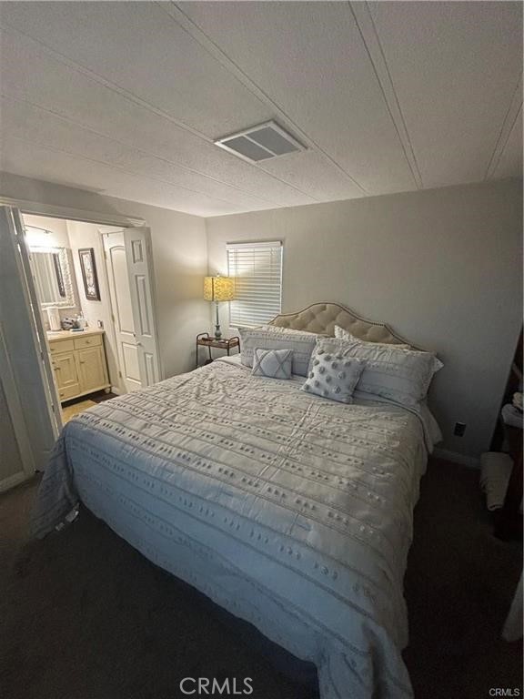 670 Channel Way Needles, CA 92363 - Photo 6 of 19 a bedroom with a bed and a mirror