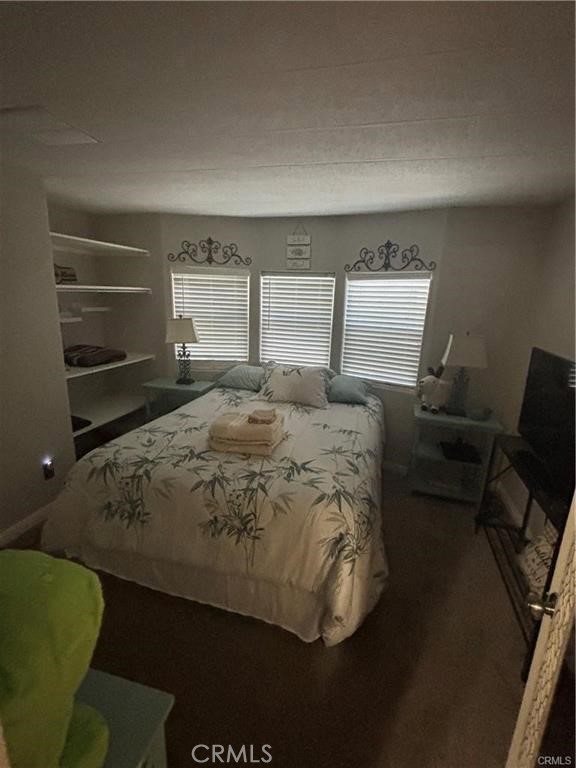 670 Channel Way Needles, CA 92363 - Photo 9 of 19 a bed sitting in a bedroom next to a window