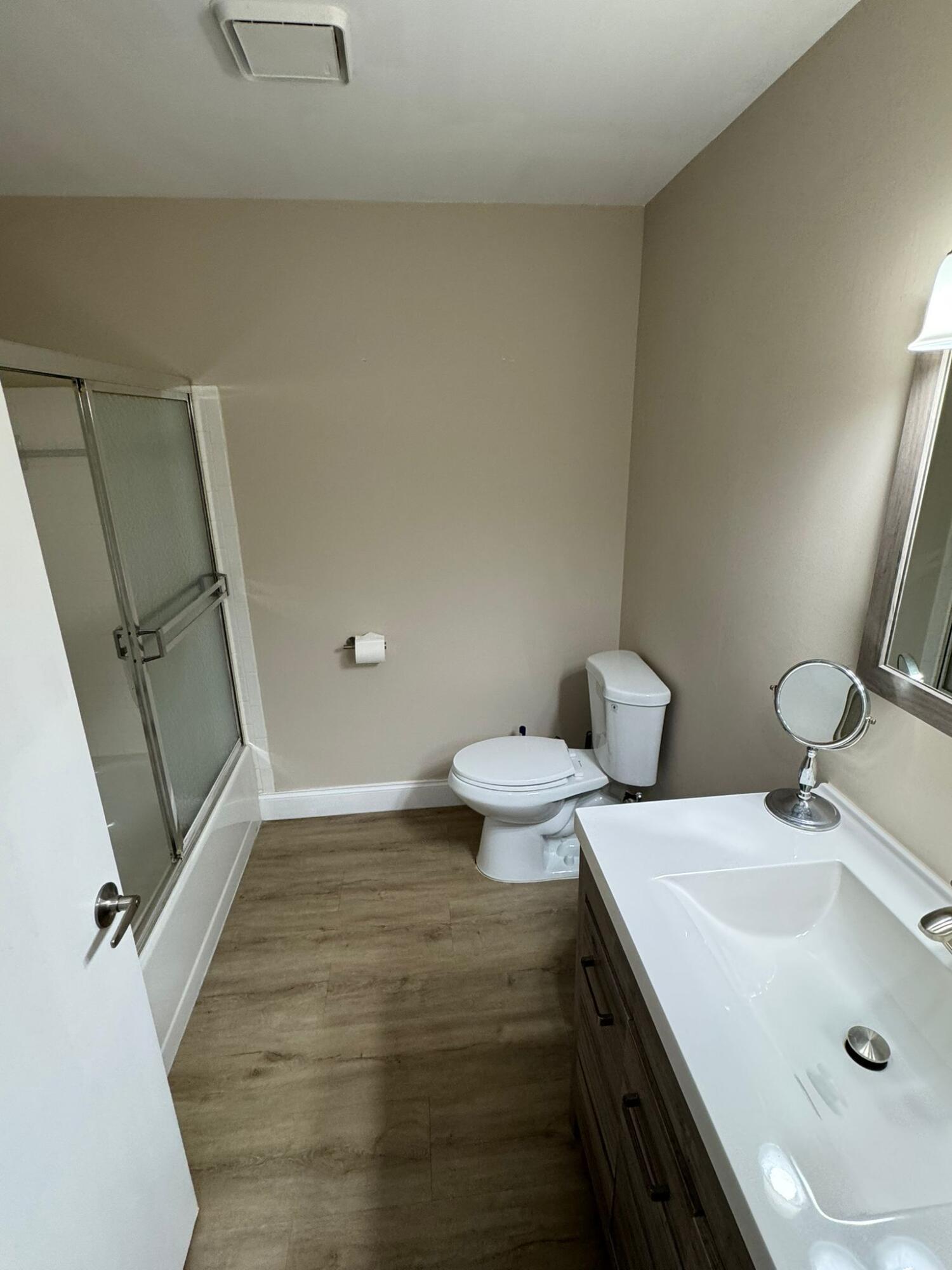 18560 Sunburst Lane, Unit D Boca Raton, FL 33496 - Photo 14 of 28 a bathroom with a sink and toilet