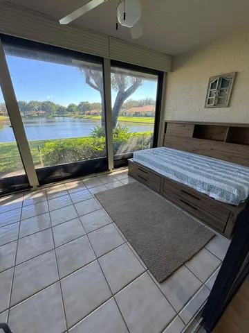 a view of a living room and floor to ceiling window