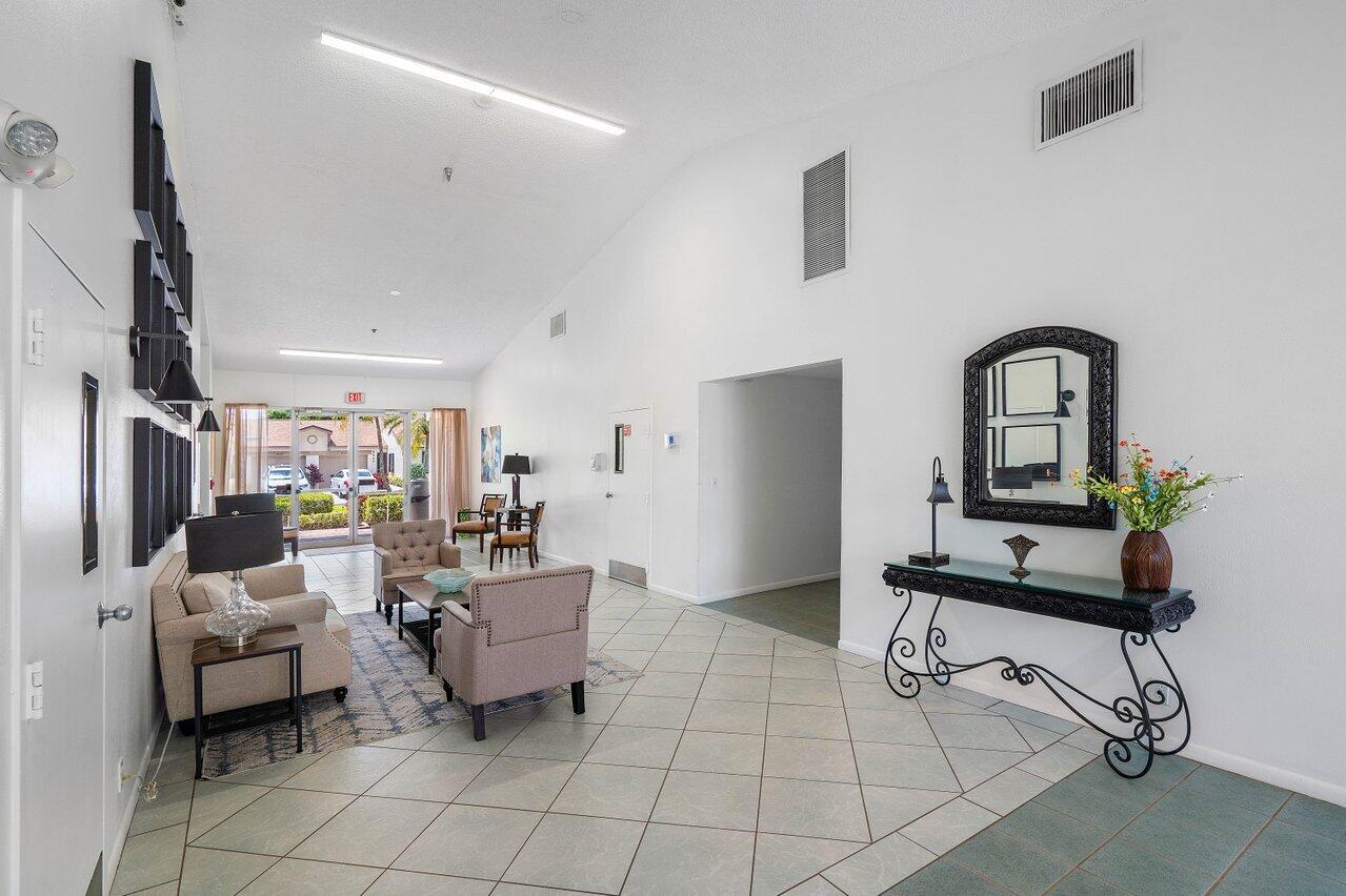 18560 Sunburst Lane, Unit D Boca Raton, FL 33496 - Photo 20 of 28 a living room with furniture