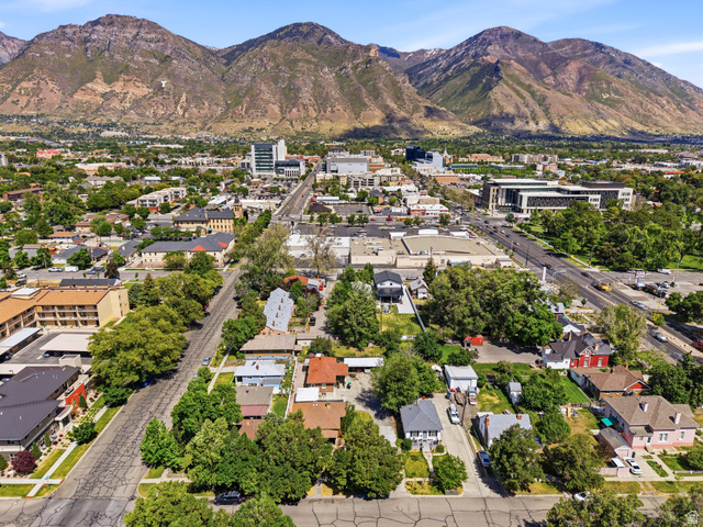 75 600 West Provo, UT 84601 - Photo 26 of 26 Expansive aerial perspective showcasing a developed urban area with varied architectural styles, mature trees, and mountainous terrain in the background