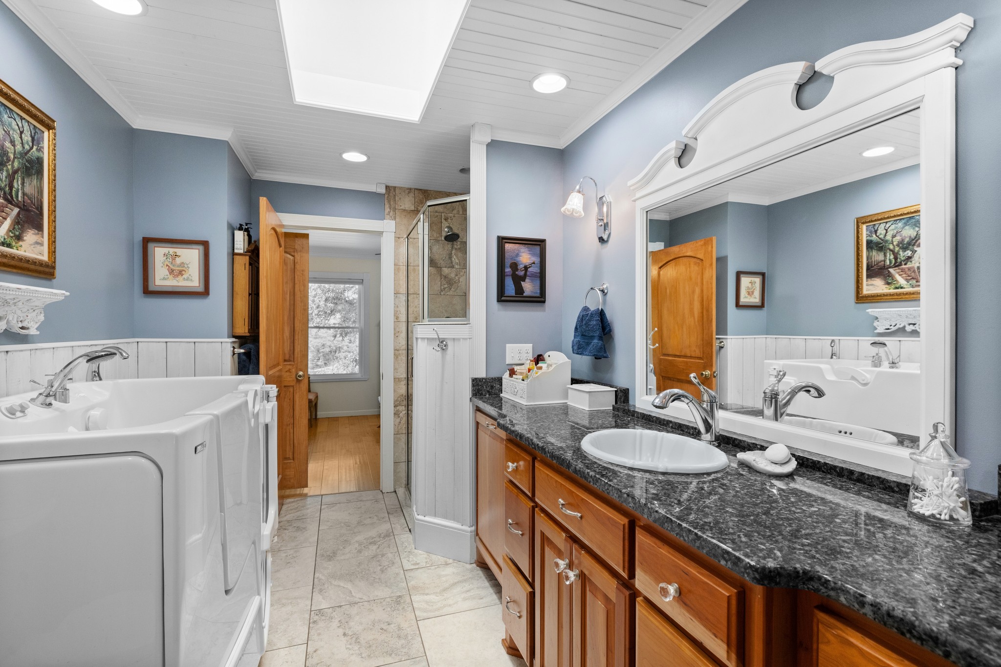1556 Chestnut Grove Road Morrison, TN 37357 - Photo 20 of 58 a spacious bathroom with a granite countertop sink and a mirror