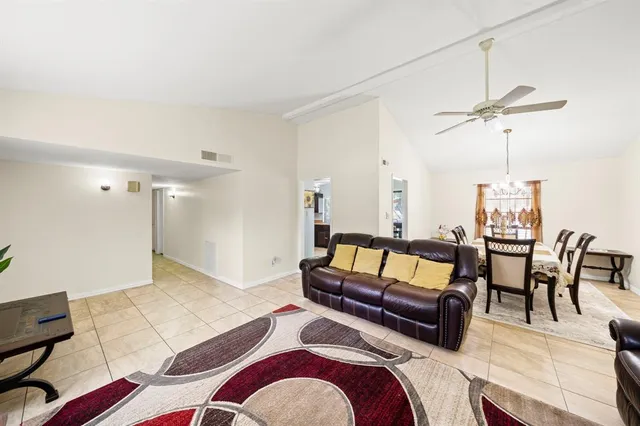 a living room with furniture and a rug