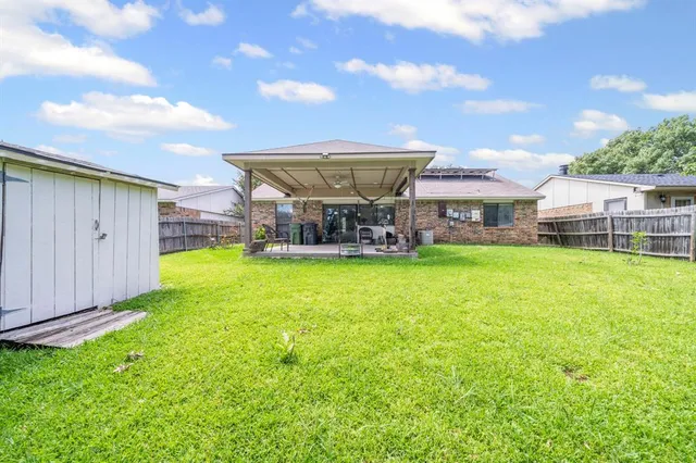 a view of a house with a yard porch and sitting area