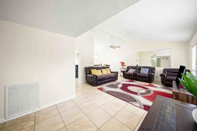 a living room with furniture and a couch