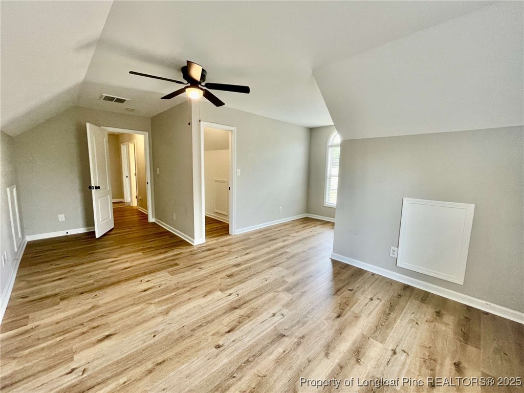 216 Cobblestone Drive Spring Lake, NC 28390 - Photo 17 of 30 a view of empty room with wooden floor