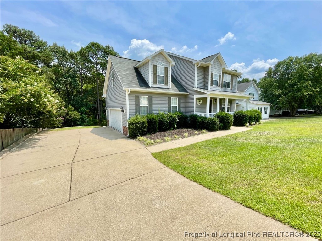 216 Cobblestone Drive Spring Lake, NC 28390 - Photo 2 of 30 a front view of house with yard and green space