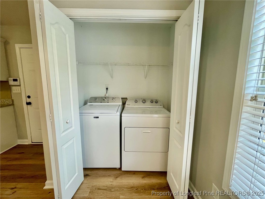 216 Cobblestone Drive Spring Lake, NC 28390 - Photo 22 of 30 a utility room with dryer and washer
