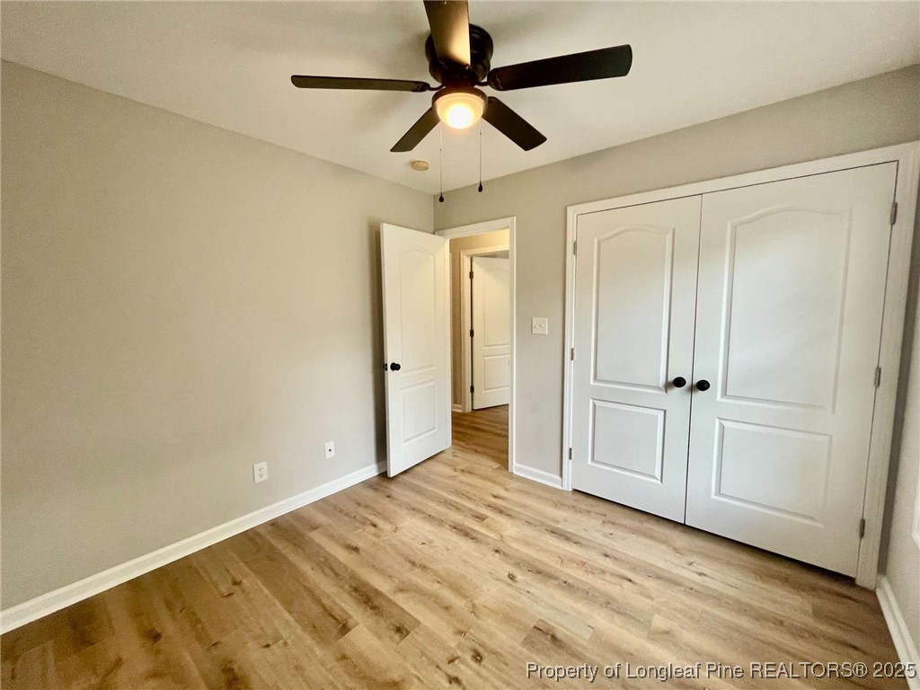 216 Cobblestone Drive Spring Lake, NC 28390 - Photo 5 of 30 a view of empty room with wooden floor