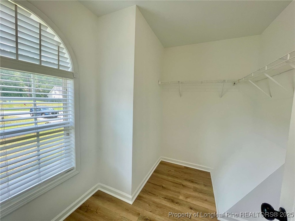 216 Cobblestone Drive Spring Lake, NC 28390 - Photo 10 of 30 a view of a room with wooden floor and a window