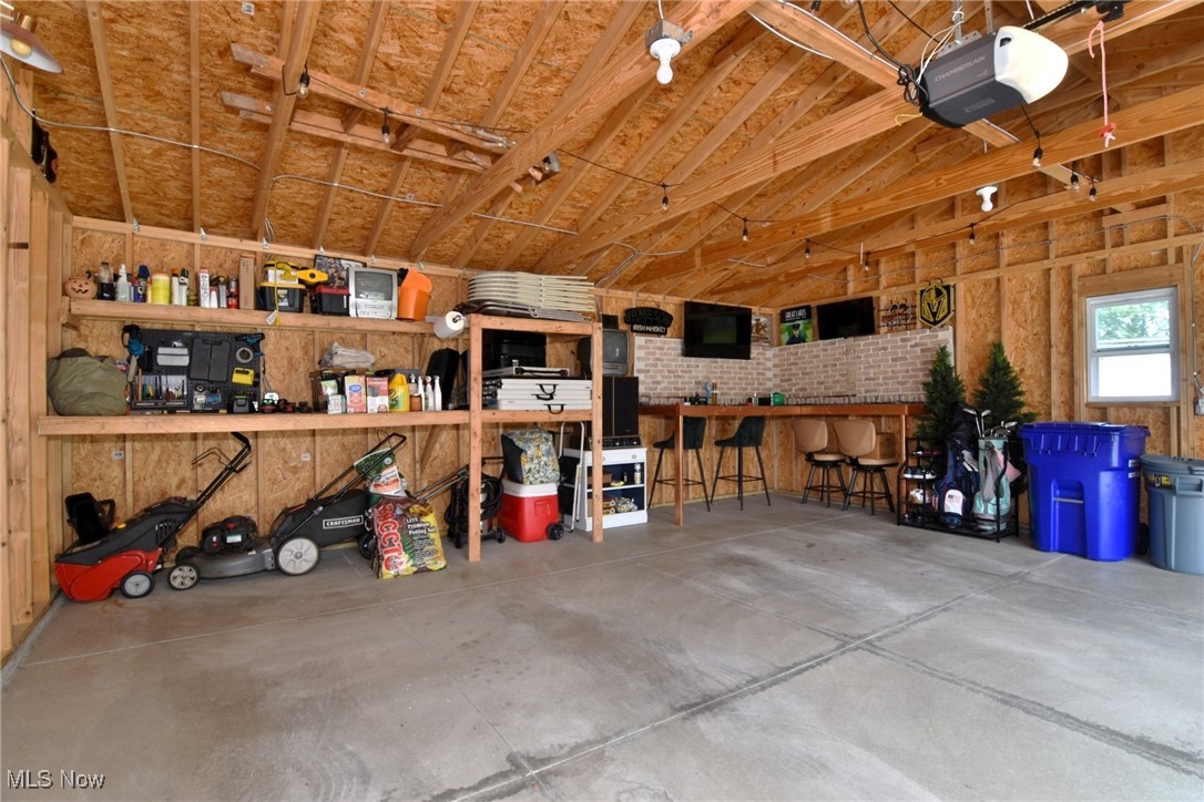 2278 Traymore Road Cleveland, OH 44118 - Photo 44 of 49 Garage featuring a garage door opener and a workshop area