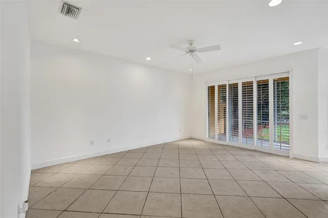 a kitchen with stainless steel appliances granite countertop a refrigerator and a stove