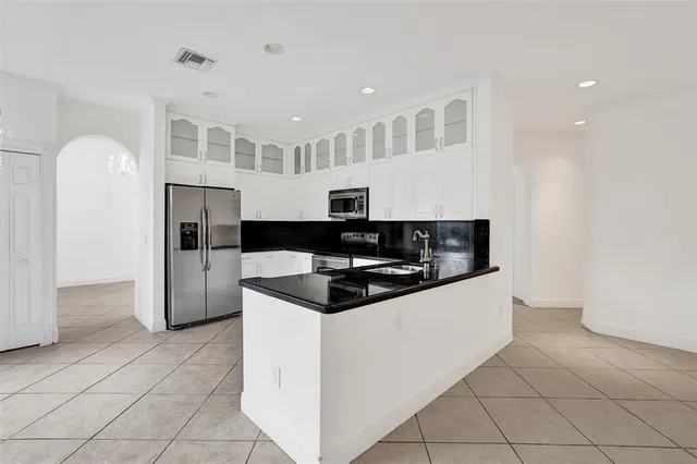 a bathroom with a sink mirror vanity and toilet