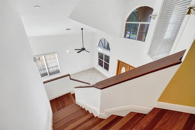 a large spacious bathroom with a double vanity sink a large mirror and a bathtub