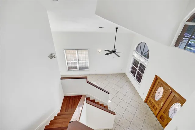 a spacious bathroom with a double vanity sink a large mirror and a bathtub