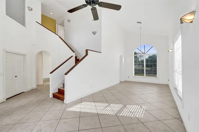 a view of a kitchen with an empty space and a window