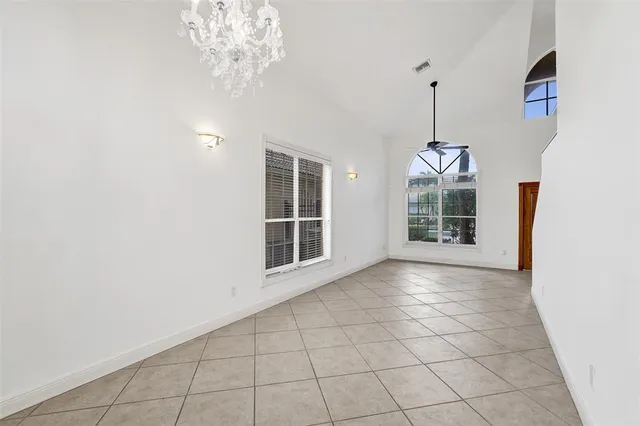 a kitchen with granite countertop a sink and a refrigerator
