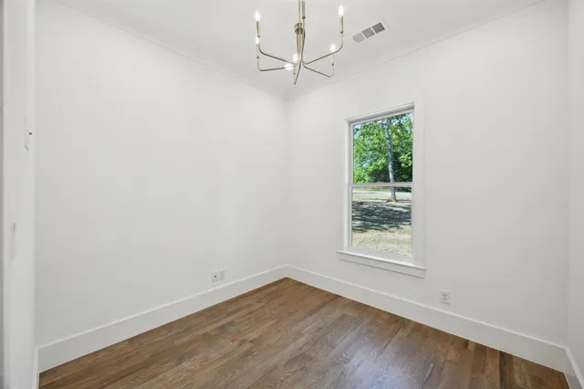 a view of a kitchen with a sink and a fireplace