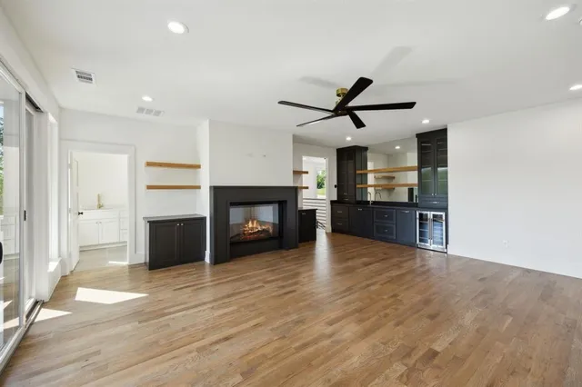 a living room with fireplace furniture and a flat screen tv