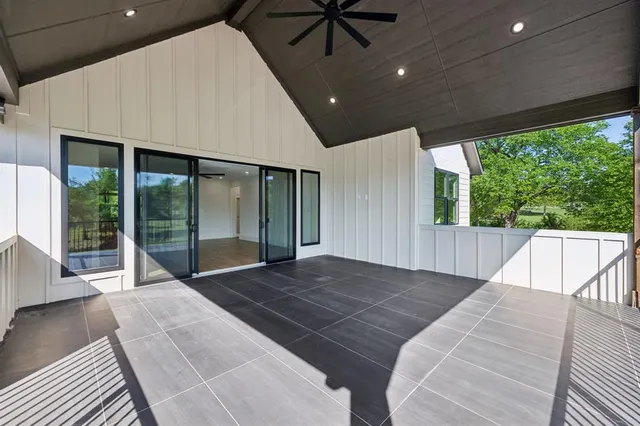 a bathroom with a sink mirror and a shower