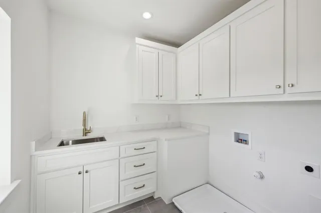 an empty room with a window and a ceiling fan