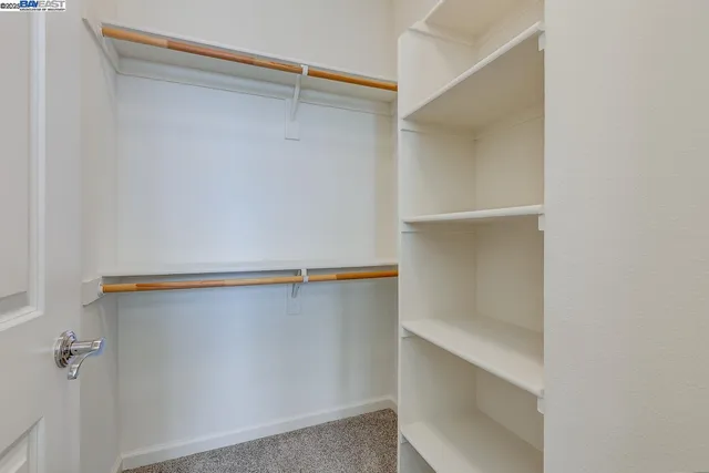 a view of an empty walk in closet