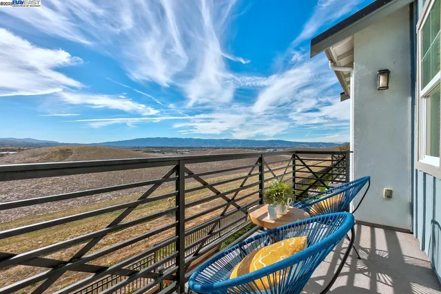 a view of a balcony with furniture