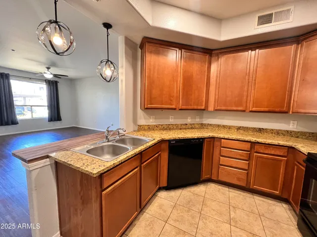 a kitchen with a sink stove and cabinets