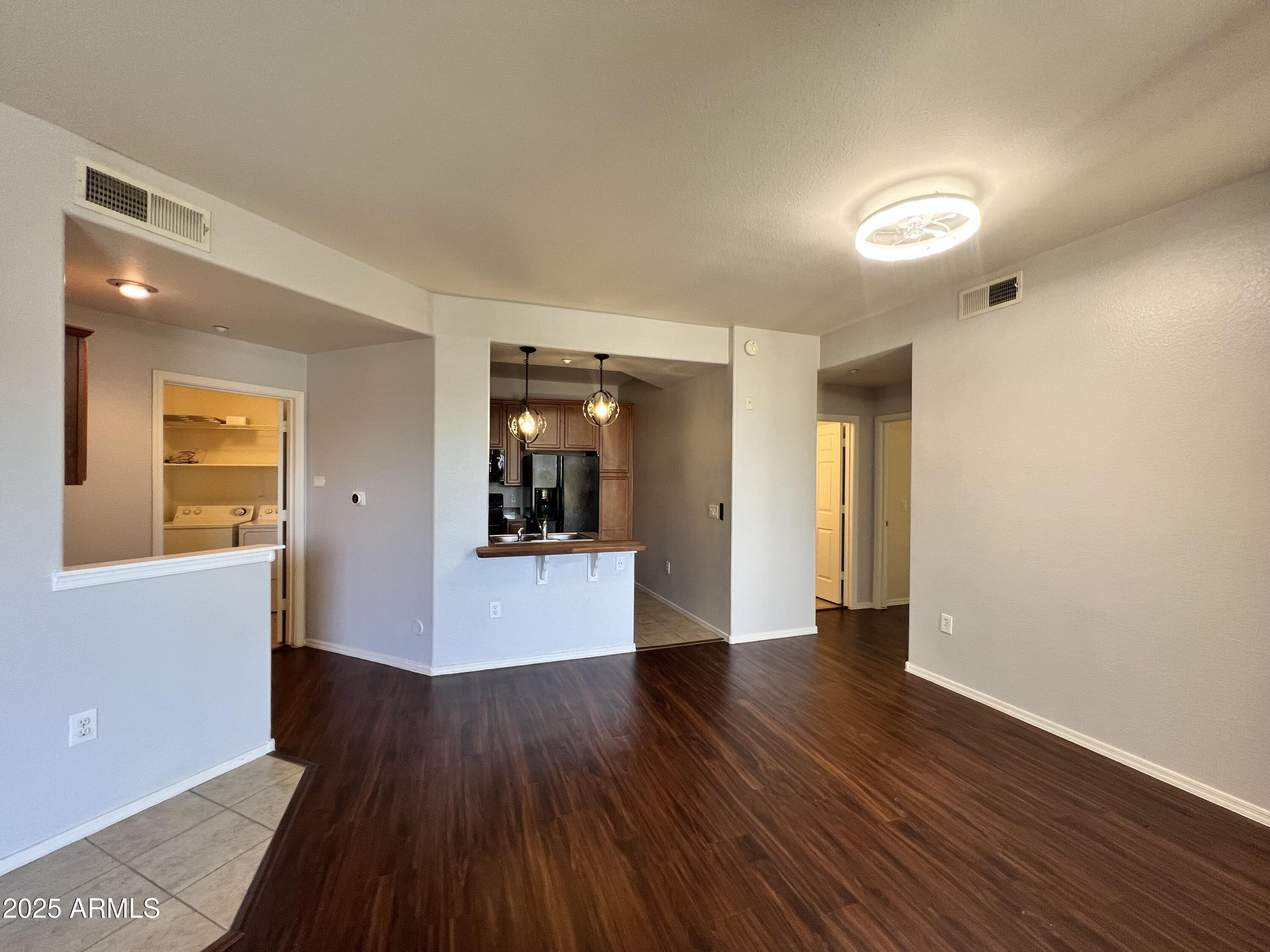 5303 North 7th Street, Unit 132 Phoenix, AZ 85014 - Photo 6 of 32 a view of a big room with wooden floor and windows
