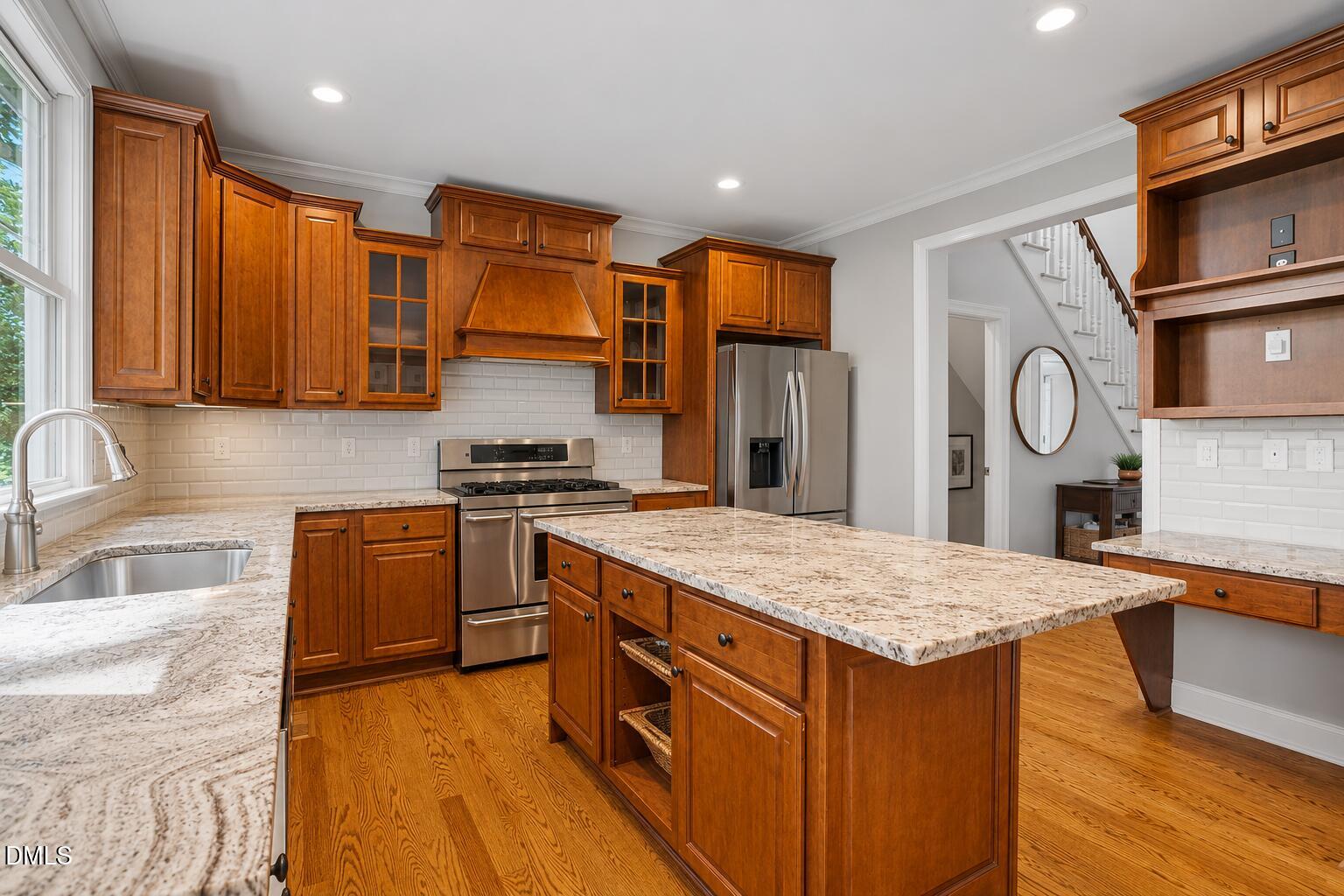 809 Gannett Street Raleigh, NC 27606 - Photo 13 of 41 a kitchen with stainless steel appliances granite countertop a sink stove and refrigerator
