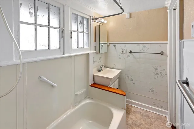a bathroom with a sink and a window