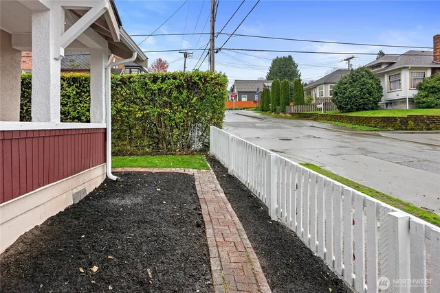 a view of building with outdoor space and trees in the background