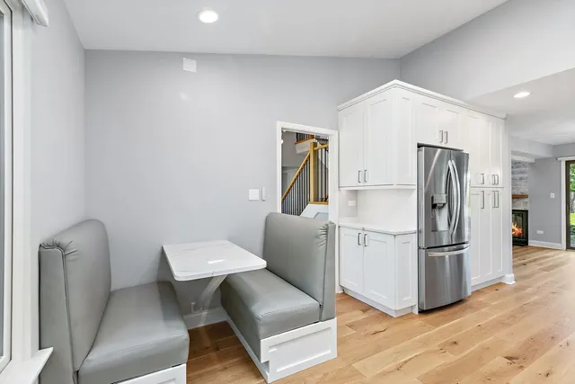 a kitchen with stainless steel appliances granite countertop a refrigerator and a sink