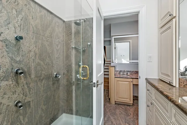 a bedroom with baby bed and a window