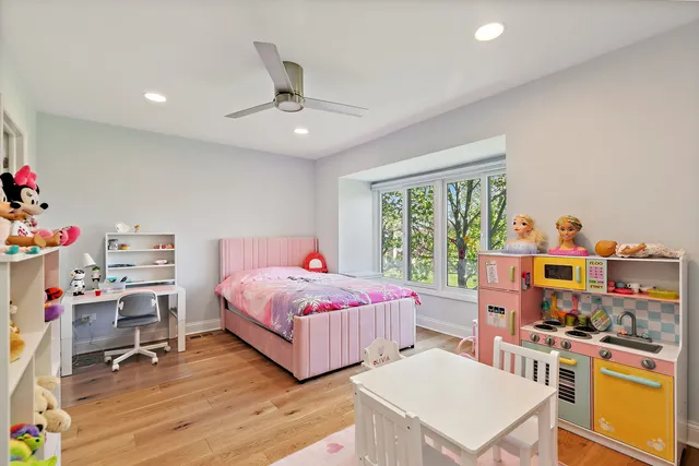 a view of a hallway with wooden floor and entryway