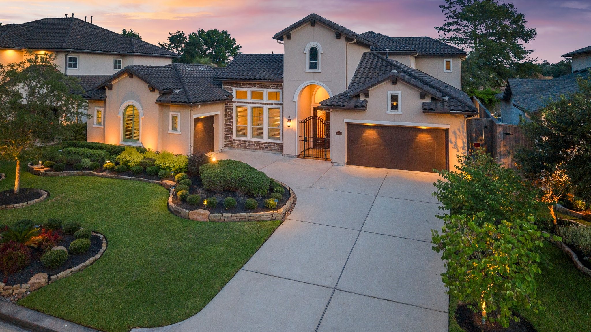 a front view of a house with garden