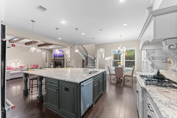 a kitchen with a stove and a table