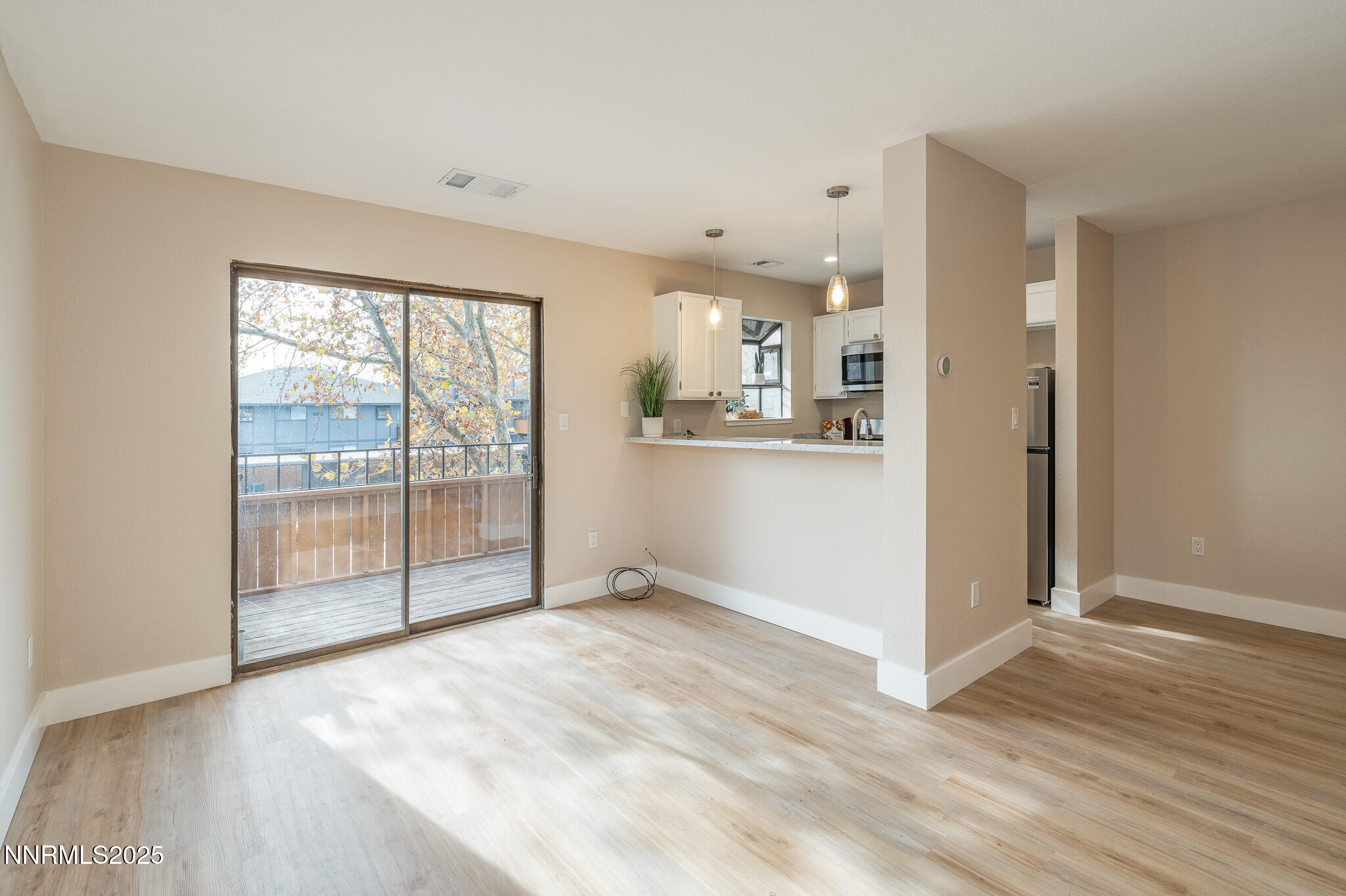 2169 Kietzke Lane, Unit B Reno, NV 89502 - Photo 1 of 20 a view of a kitchen with wooden floor and windows