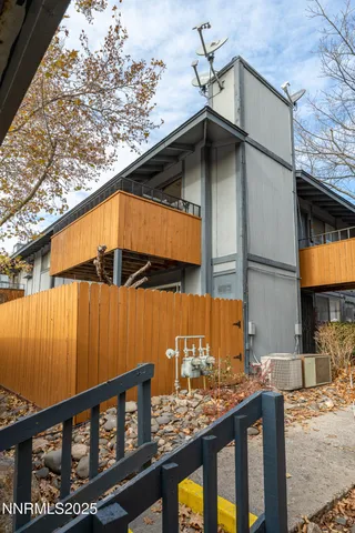 a view of a house with wooden deck