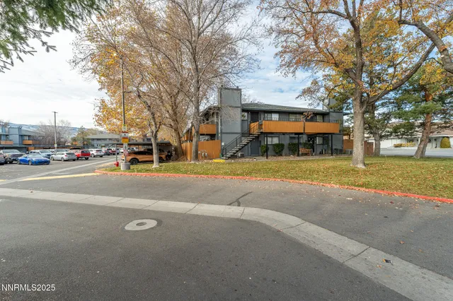 a view of street with parked cars