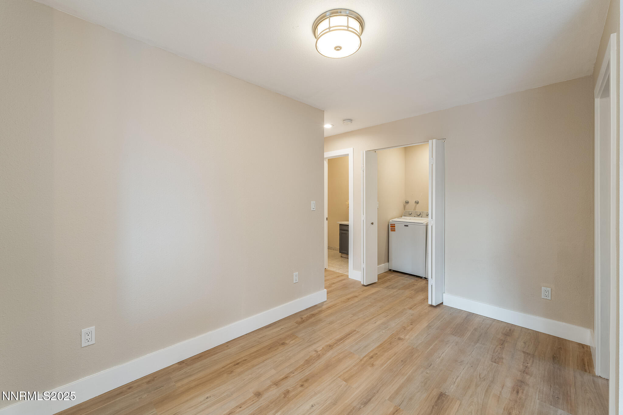 2169 Kietzke Lane, Unit B Reno, NV 89502 - Photo 10 of 20 a view of a room with wooden floor and a window