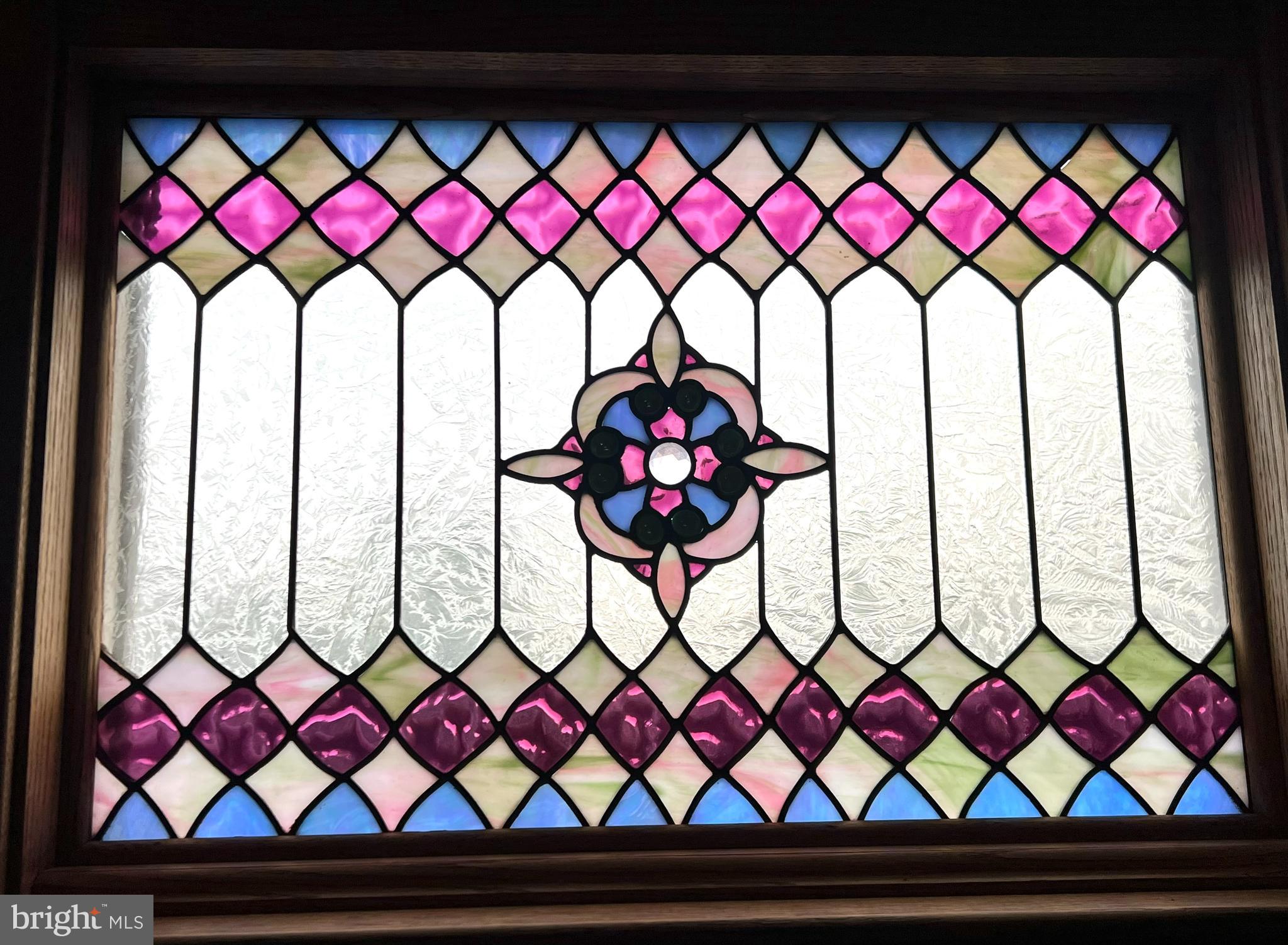 9218 Colesville Road Silver Spring, MD 20910 - Photo 64 of 76 Main staircase stain glass windows