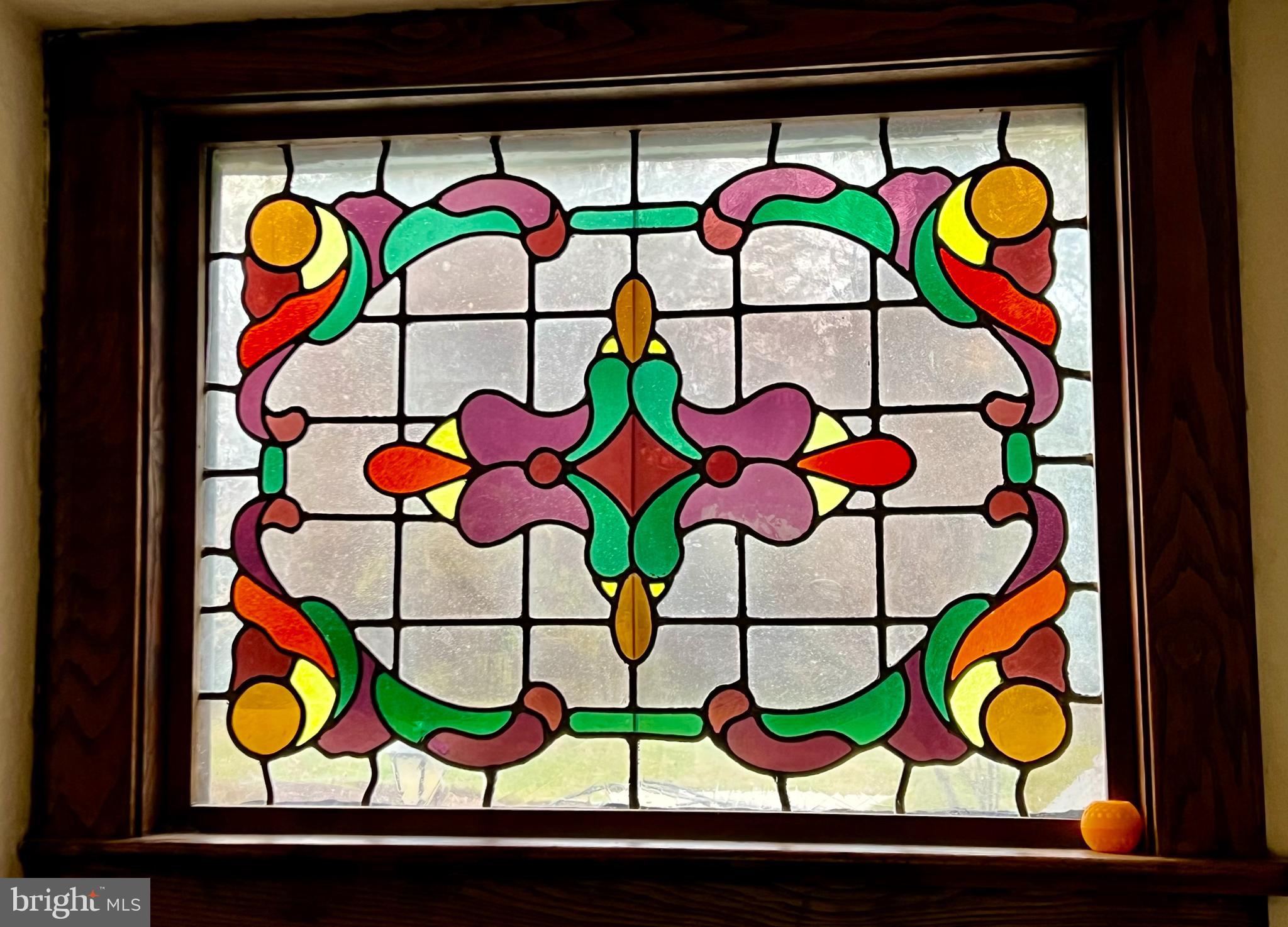 9218 Colesville Road Silver Spring, MD 20910 - Photo 65 of 76 Enjoy sun streaming through the stain glass window