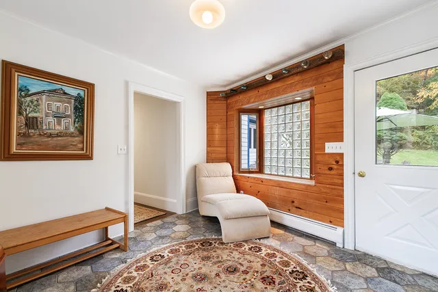 a living room with furniture and a window