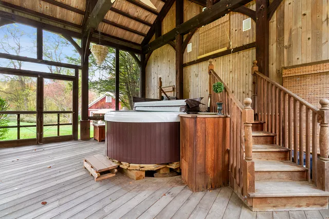 a work room with wooden floor stairs and furniture