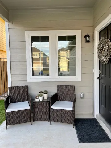 a bedroom with furniture and a window