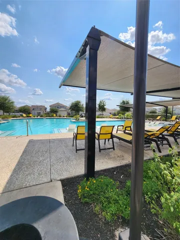 a view of a swimming pool with a patio