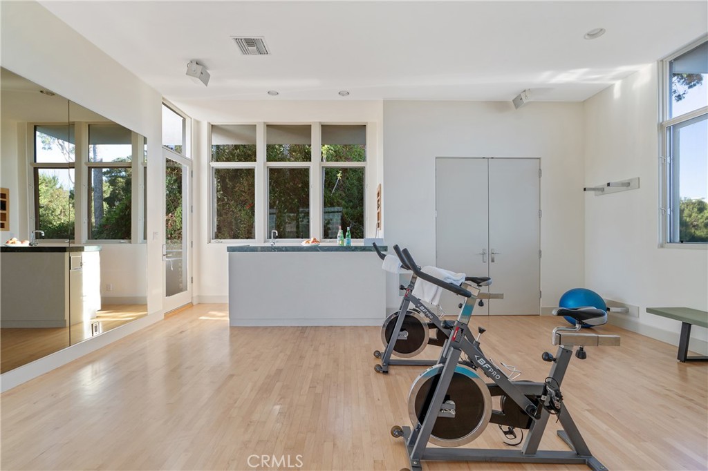 1436 Summitridge Drive Beverly Hills, CA 90210 - Photo 19 of 28 a view of a room with gym equipment